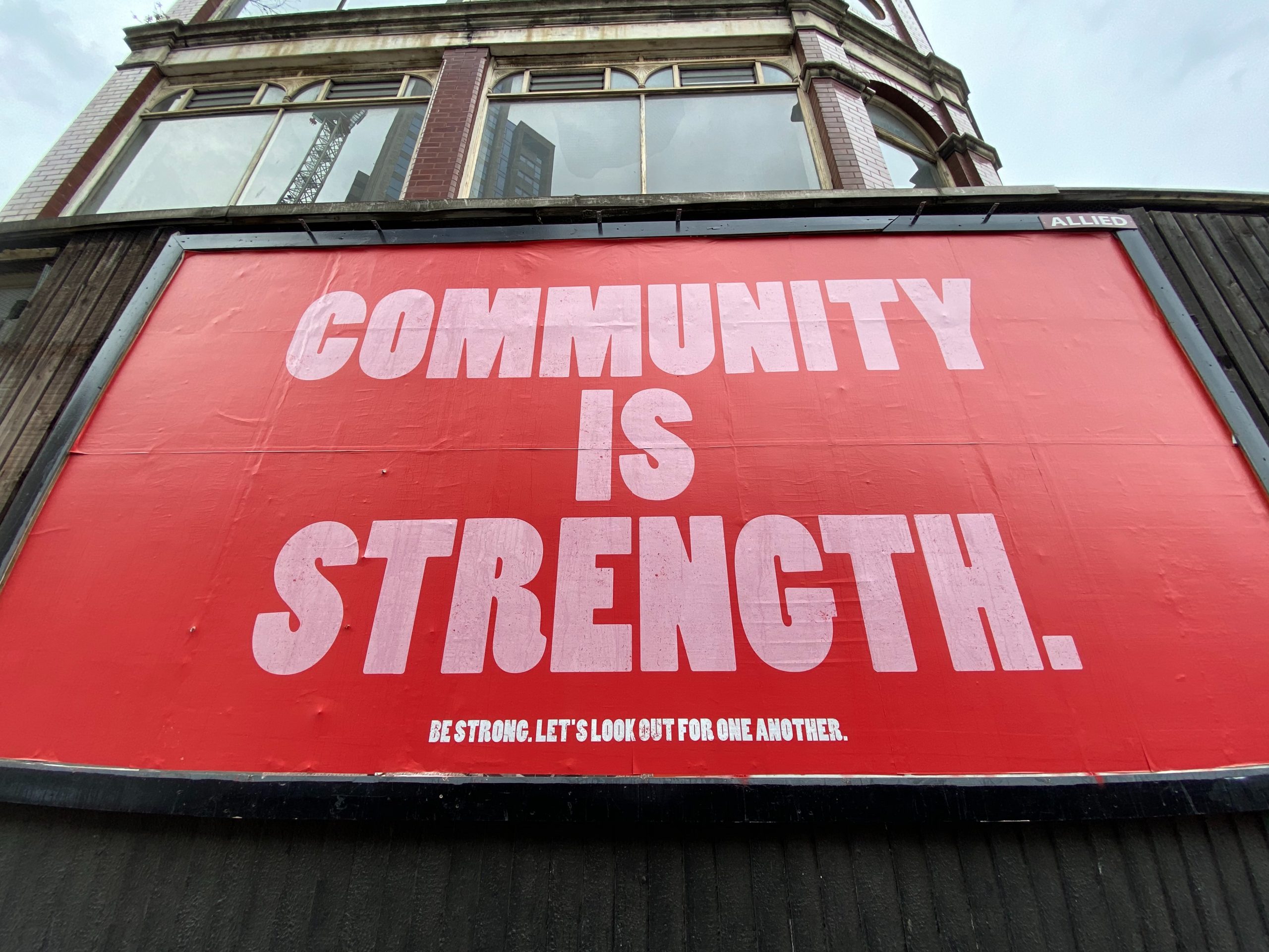 "Community is Strength" banner